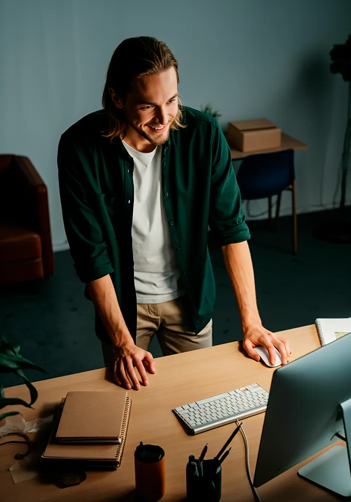 Man smiling using the computer